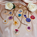 Explore our range of preserved flowers in resin, each month with its own corresponding preserved flower on an 18k gold plated chain.